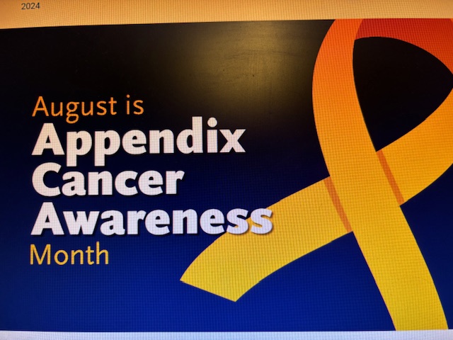 A sign with an orange ribbon and the words " august is appendix cancer awareness month ".