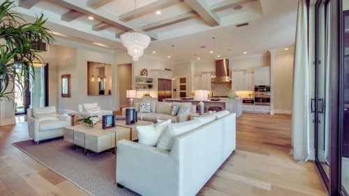 A living room filled with furniture and a large window.